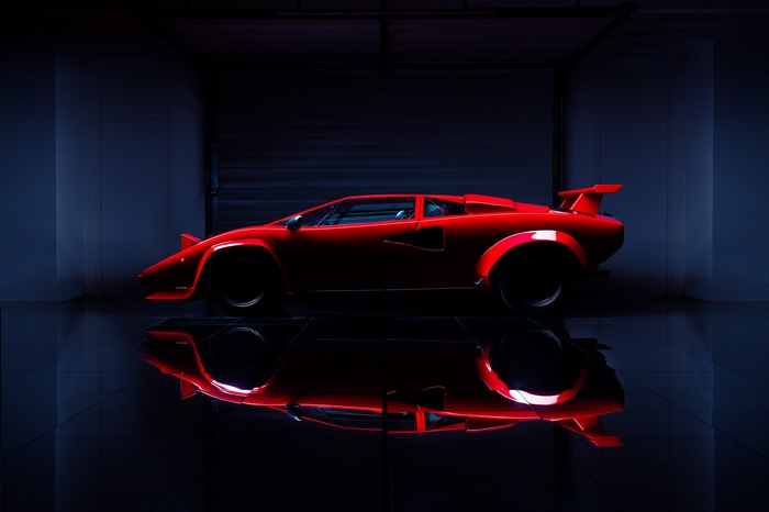Red Lamborghini Countach in a dark garage