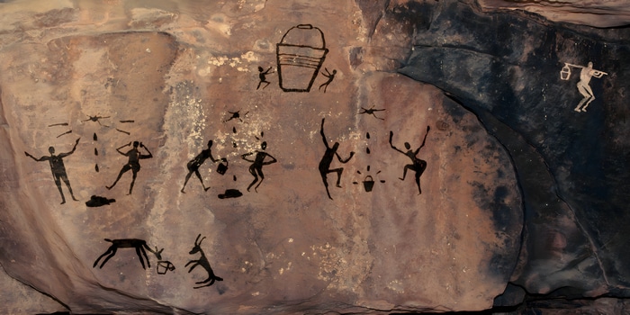 Cave painting with bucket and people