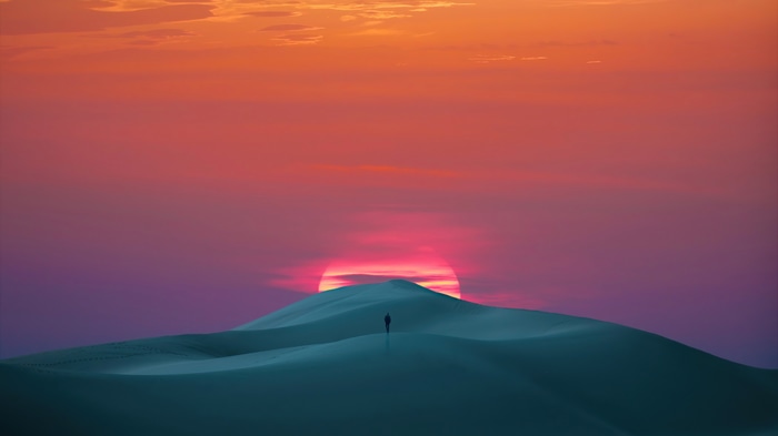 4K Desert Landscape at Sunset with a Lone Figure