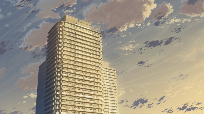 Skyscrapers against a cloudy sky at sunset