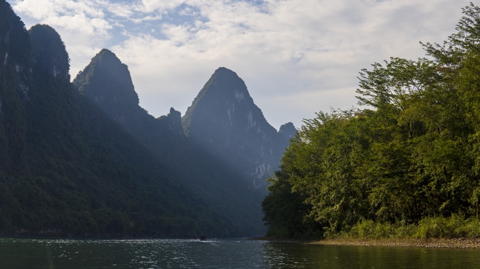 River and karst mountains with trees