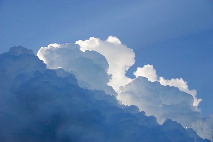 Cumulonimbus clouds against a blue sky