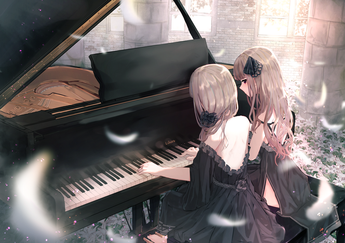 Two girls playing piano