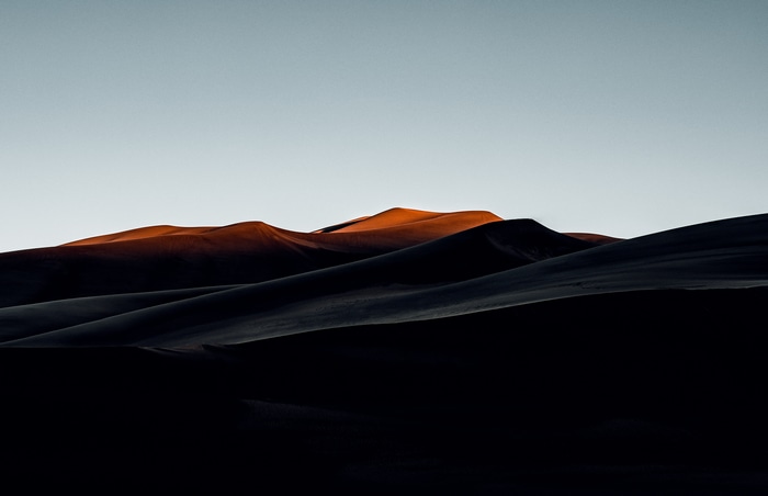 Desert dunes at sunset