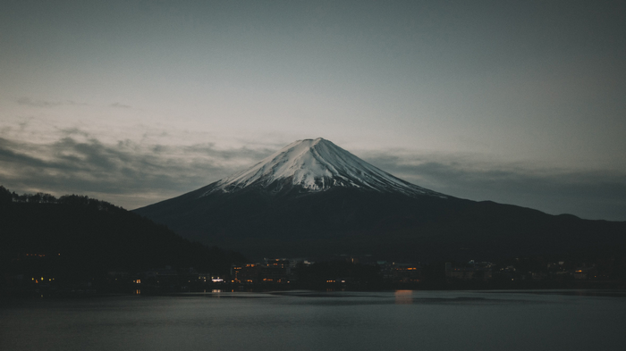 Mount Fuji with snow and lake at dusk
