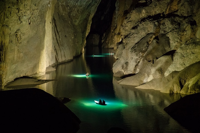 Boats on a river inside Hang Son Doong cave, Vietnam