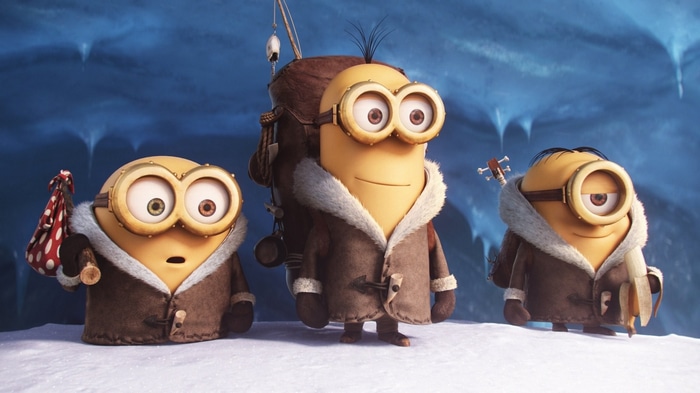Minions in winter coats in an icy cave