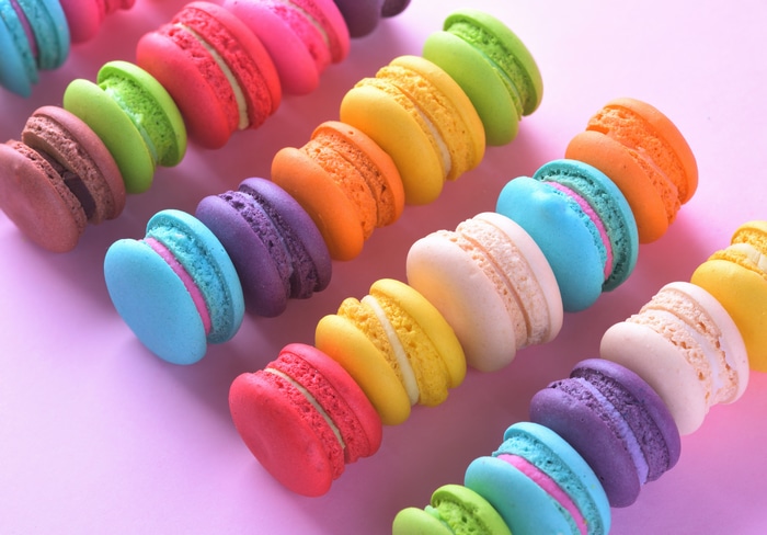 4K colorful macarons on a pink background
