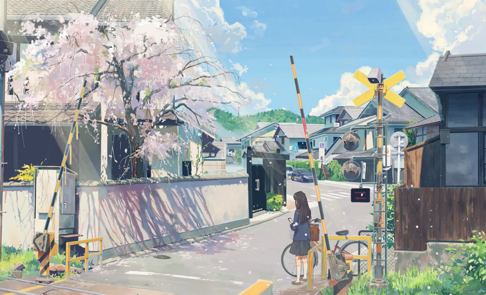 Girl at a cherry blossom train crossing