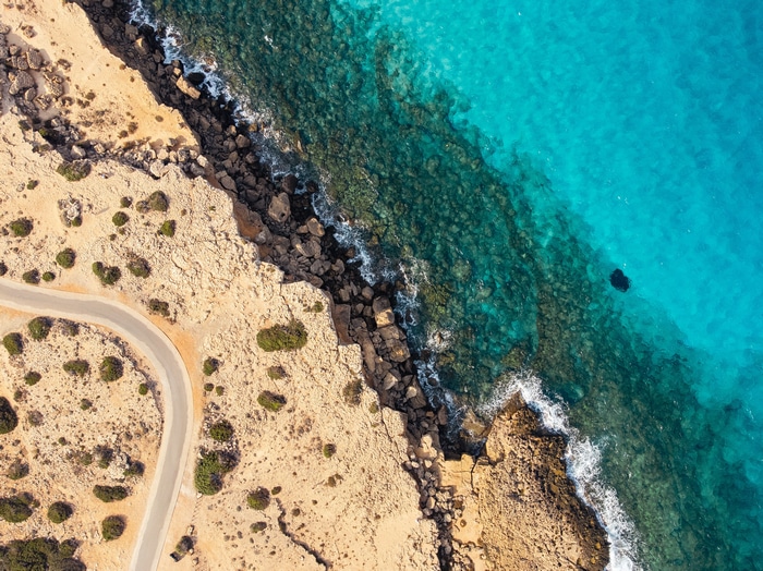 Aerial view of a rocky coast and turquoise water