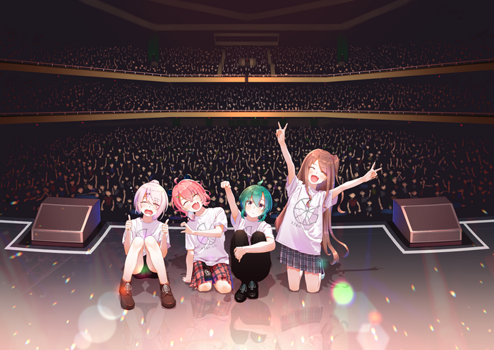 Virtual YouTubers performing on stage in front of a crowd
