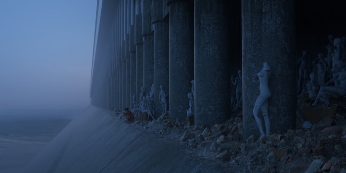 Luzhan Liu among mannequins in a foggy landscape