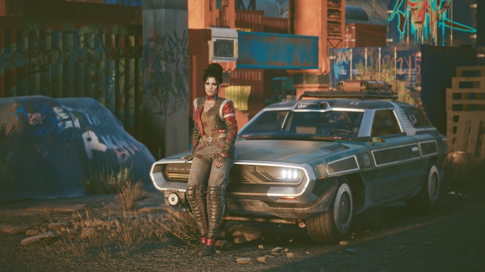 Panam Palmer leaning on a car in Cyberpunk 2077
