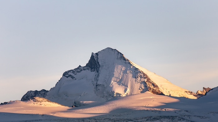 Snow-covered mountains in Switzerland under a clear sky