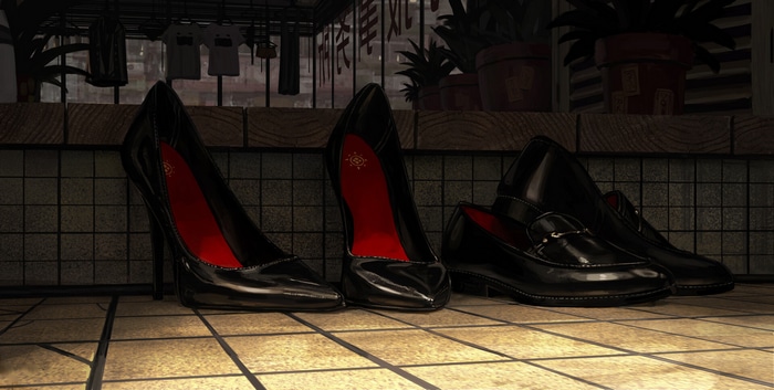Black high heels and loafers on a tiled floor