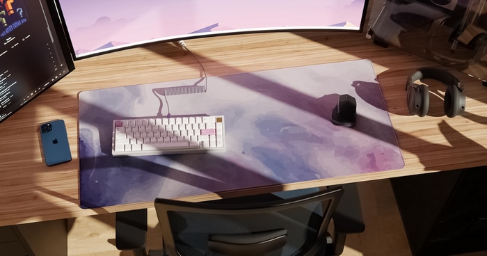 Desk with mechanical keyboard, mouse, and headphones