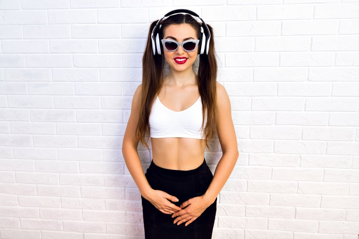 Woman with headphones and sunglasses