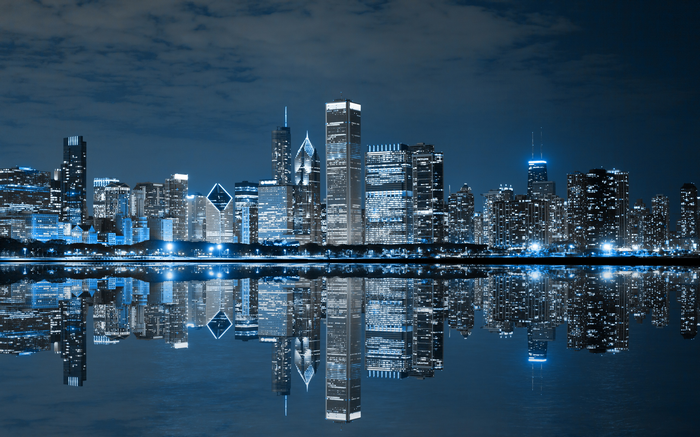 Chicago skyline at night with reflections in the water