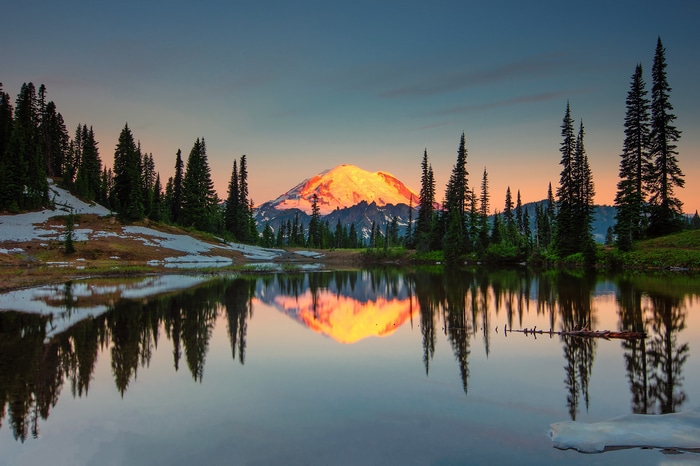 Mount Rainier reflected in a lake at sunset