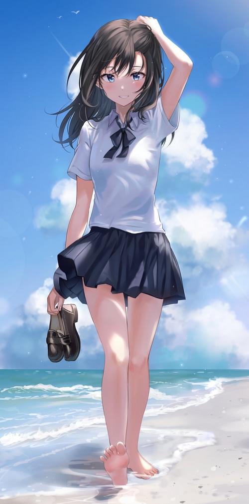 Girl in school uniform on the beach