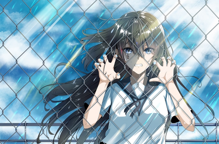 Girl with blue eyes behind a fence