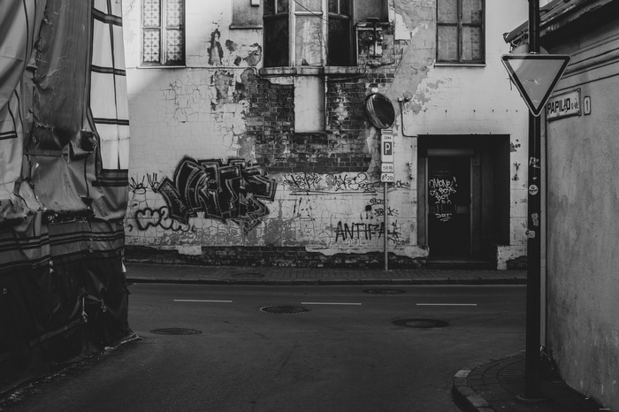 Monochrome urban street with graffiti