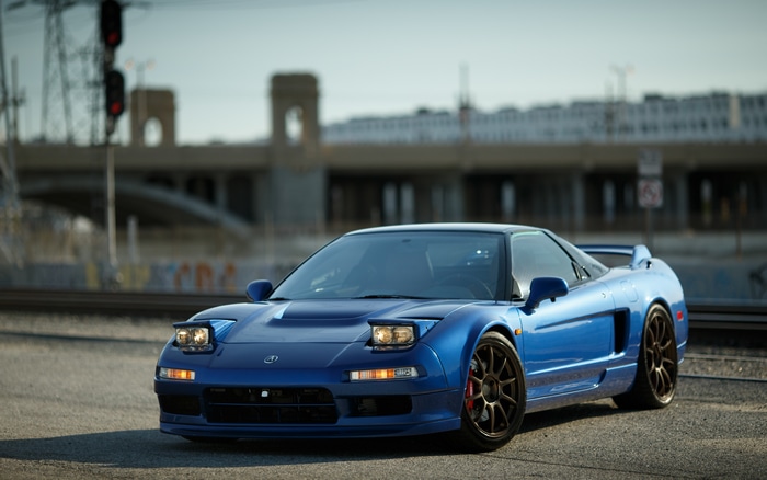 Blue Honda NSX mk1 sports car with pop-up headlights