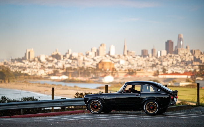 Black Japanese car with San Francisco skyline