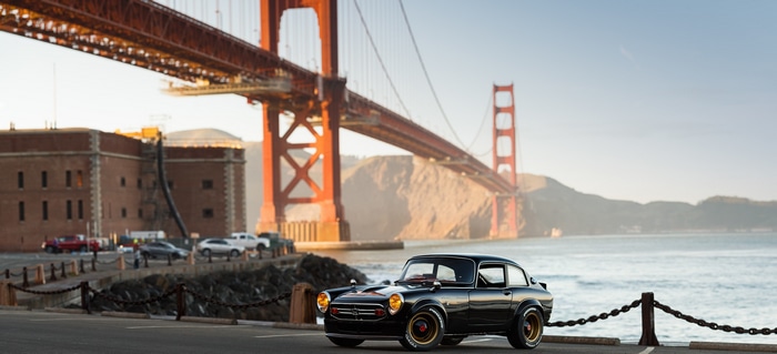 Black Honda S800 parked near Golden Gate Bridge