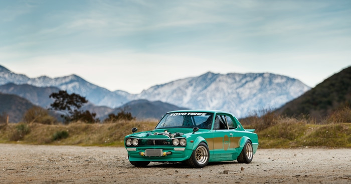 Teal Nissan Skyline C10 with bodykit and Toyo Tires