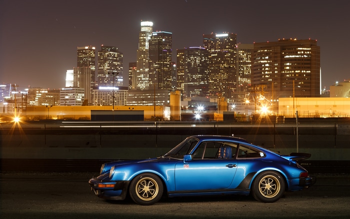 4K Porsche 930 Turbo parked at night with city lights