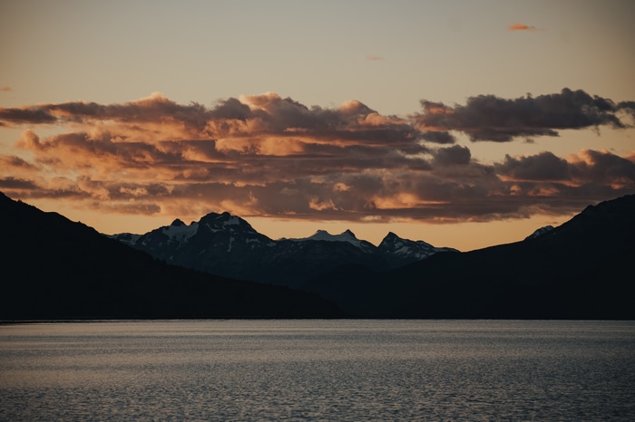 4K sunset over mountains and lake