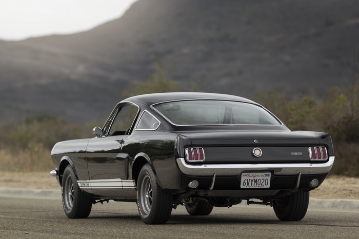 Black Ford Mustang Shelby GT 350 on a road