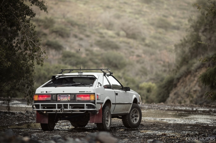 Modified Toyota Celica GT-S off-road in a dry riverbed