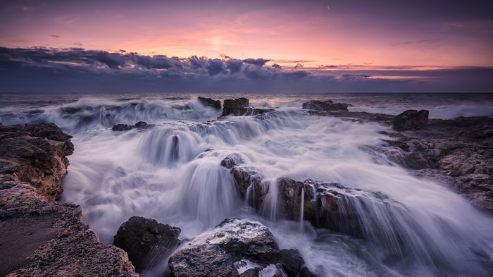 4K waves crashing on rocky coast in Bulgaria at sunset