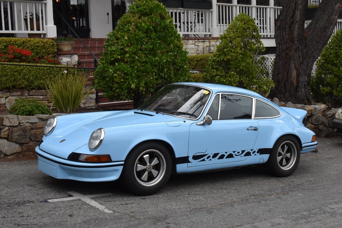 Light blue 1973 Porsche Carrera 2.7 RS parked outdoors