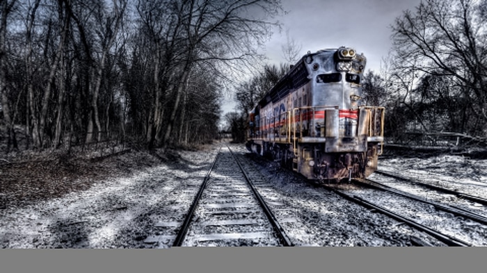 4K Winter Scene with Diesel Locomotive on Snowy Tracks