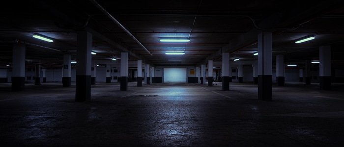 Dark urban parking garage at night