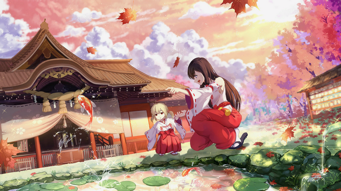 Two Miko girls in a Japanese shrine during autumn