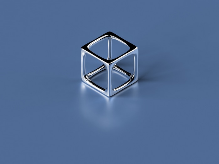 A chrome cube on a blue background