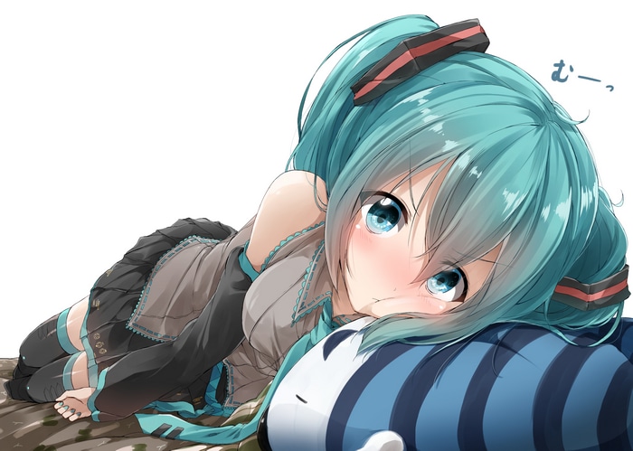 Hatsune Miku lying down on a pillow