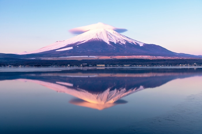 4K Mount Fuji reflected in a lake with lenticular clouds