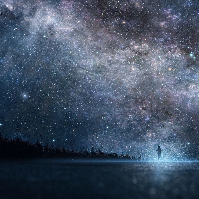 Person running under a starry night sky