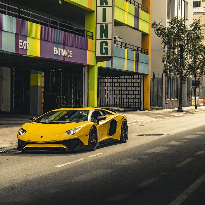 Yellow Lamborghini Aventador parked on a street
