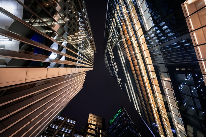 Modern skyscrapers at night with illuminated windows