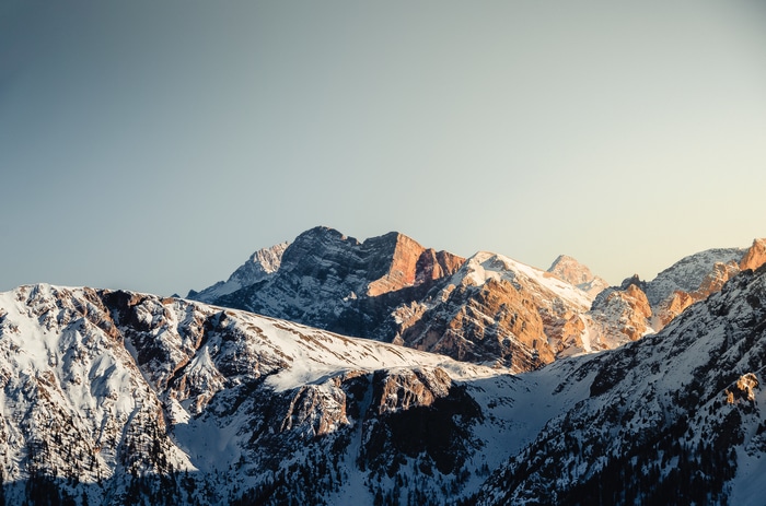 4K snow-covered mountains with forest