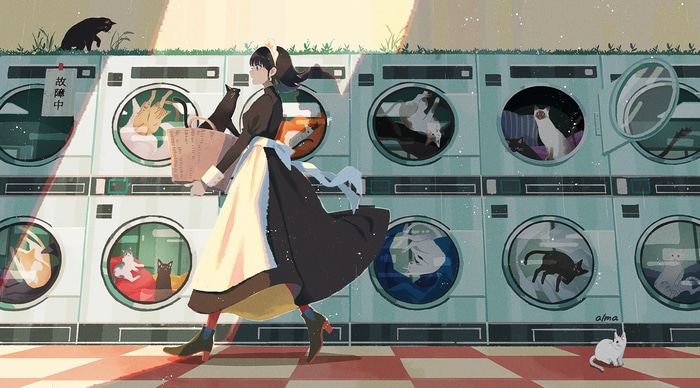 Maid with cats in a laundry room