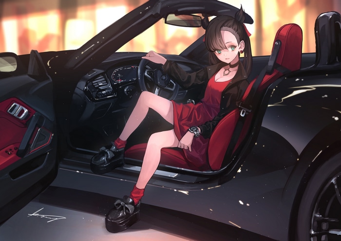 Marnie in a red dress in a black car