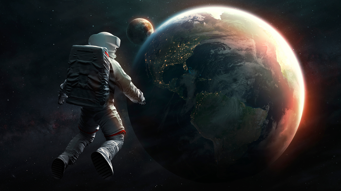 Astronaut floating in space near Earth
