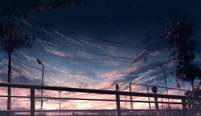 Starry night sky over a city with clouds and power lines